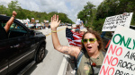 Protesters line highway in Florida Everglades to oppose Alligator Alcatraz AP News Protesters line highway in Florida Everglades to oppose Alligator Alcatraz AP News