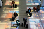 Airport bottlenecks ease as TSA workers get paid but shutdown continues  AP News