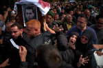 Lebanese bury 13 officers killed by Israel as grief and outrage surge ahead of talks in the US  AP News