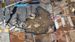 Massive sinkhole swallows Sunset Boulevard floods LA streets  USA Today
